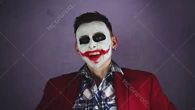 Creepy joker laughing
