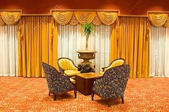Draped curtains and chairs