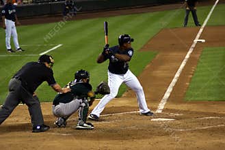 Baseball plate umpire, catcher, batter at work