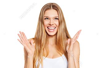 Surprised happy beautiful young woman looking up in excitement. Isolated over white