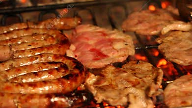 Fireplace with grilled meat during cooking on the grill