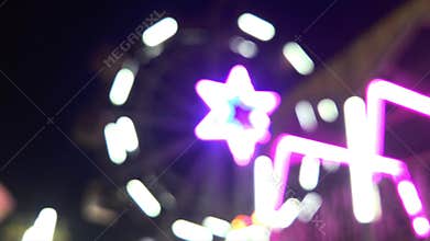 Blurred Ferris Wheel Lights at Night, Colorful Bokeh Funfair Carnival with Crowd in Indian Night Market