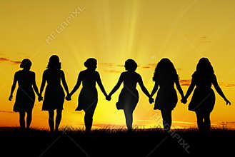 Women walking hand in hand