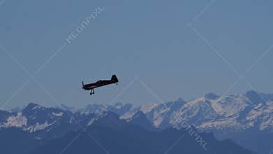 4K Slow Motion Sukhoi Su-26 Aerobatic Plane Tumbling Over Snow Peaks