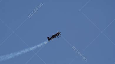 4K Slow Motion Sukhoi Su-26 Aerobatic Plane Roll Against Blue Sky
