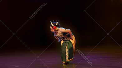 Respectful Bow Pose in Traditional Cultural Performance