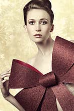 Woman adorned with bow