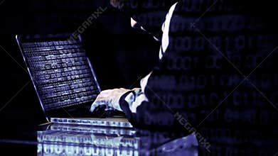 Hacker working on his laptop