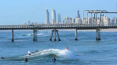 Surfers in Surfers Paradise skyline Gold Coast Australia