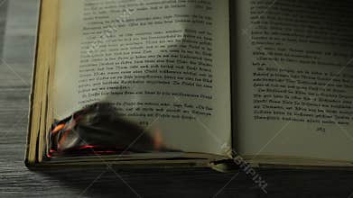 Burning antique book