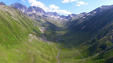 Aerial Kackar Mountains Turkey valley stream and green meadows open across treeless alpine terrain, water, rocks, creek, turkiye