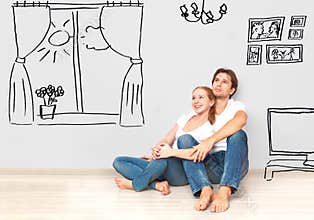 Concept : happy couple in new apartment dream and plan interior