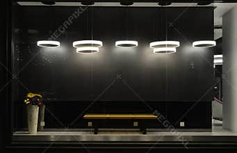 Empty store window with led light bulbs,LED lamp used in shop window,Commercial decoration,black grey background