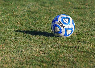 NCAA College Soccer Ball on Grass Field
