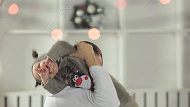 Happy dad plays with his incredibly nice and