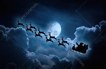 Christmas background. Silhouette of Santa Claus flying on a sleigh pulled by reindeer.