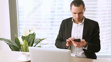Angry annoyed young businessman having bad working day in office
