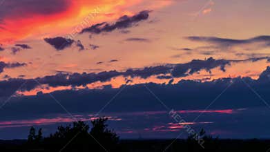 Timelapse. Sunset with flying clouds in Germany