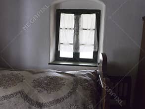 Retro bed and white curtain
