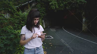Young woman waits for her taxi