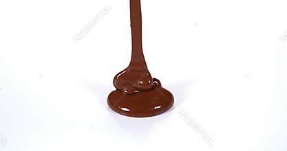 Chocolate Flowing on White Background,