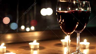 The radiance reflected in glasses with wine during a romantic evening
