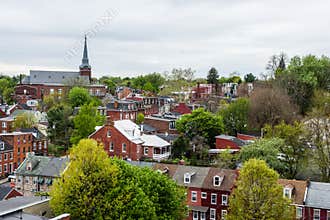 Aerial of historic downtown Lancaster, Pennsylvania with blooming trees