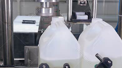 Production Machine tightening the Bottle Caps on Medicine, chemical Bottles on the Conveyor. 4K.