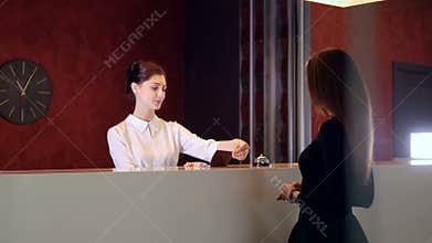 Service manager at hotel lobby meets visitor. 4K.