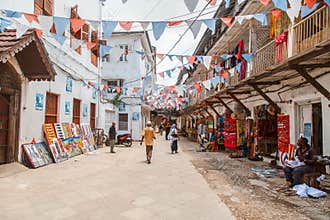 Local people on a square in Stone Town. Stone Town is the old part of Zanzibar City, the capital of Zanzibar, Tanzania