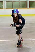 Teen girl playing roller derby