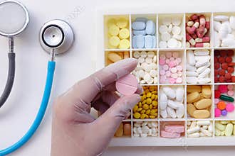 Different medication with stethoscope isolated
