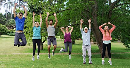 Group of people exercising together in the park