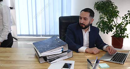 Young businessman getting rebuke from his female boss in the office, 4K