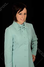 Woman wearing aqua coat