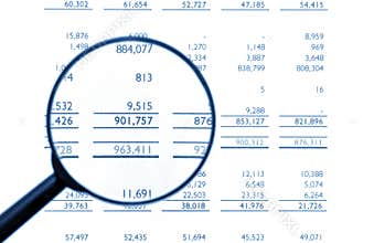 Magnifying Glass On Financial Balance Sheet