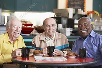 Senior men drinking tea together