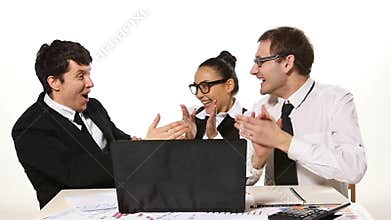 Business team cheerfully talking, very happy news