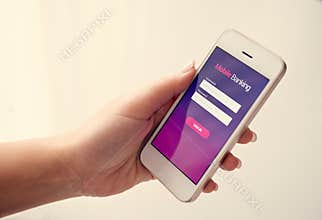 Female hand using mobile banking