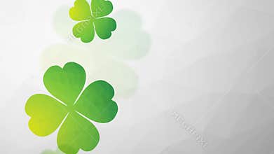 Falling and rotating green four-leaf clovers