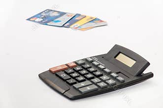 Calculator and credit cards blured in the background