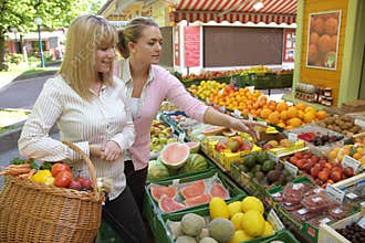 Two women on the fruit market