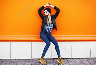 Street fashion concept - stylish cool girl in rock black style
