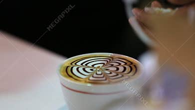 Barista prepares latte. Latte art.