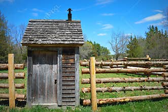 Log Fence Outhouse