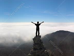 Man on the top of a rock