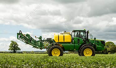 John Deere sprayer spraying in bean field