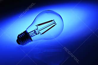 New led lamp bulb over blue background