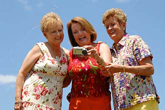 Senior friends checking photo