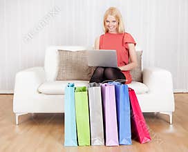 Beautiful young woman buying clothes